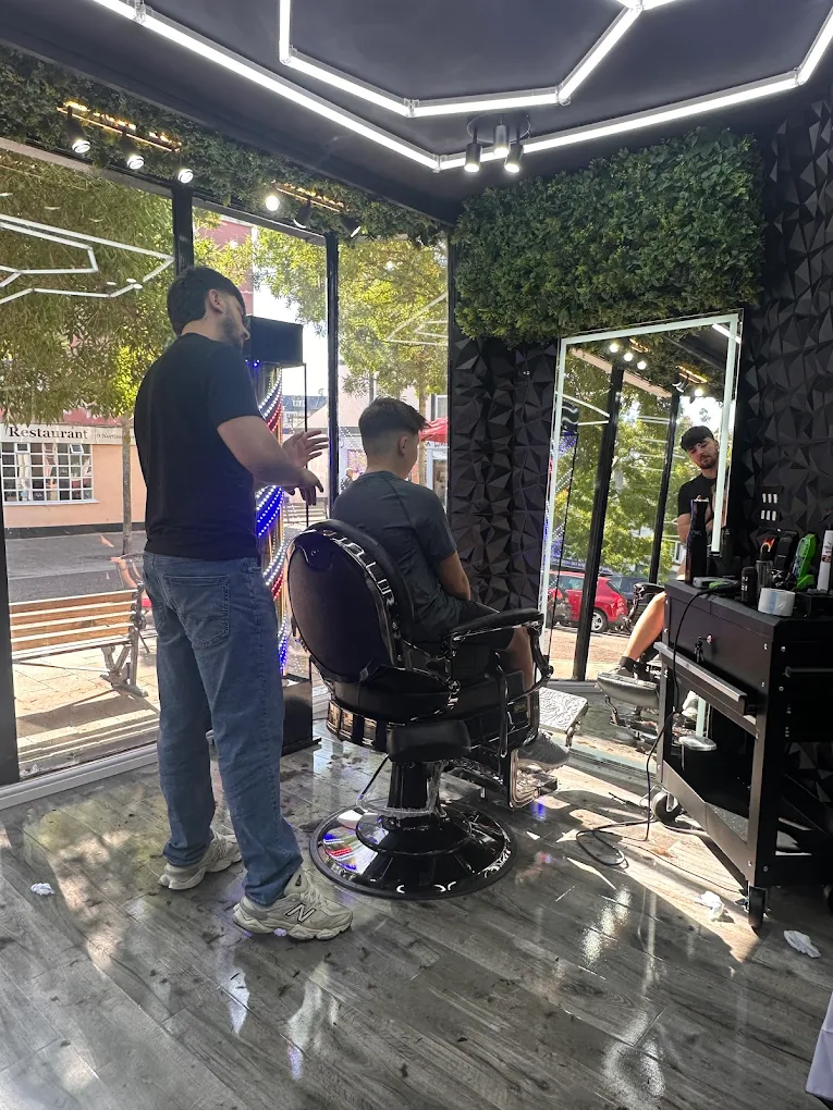 Hishyar cutting hair at H Barbers, Teignmouth